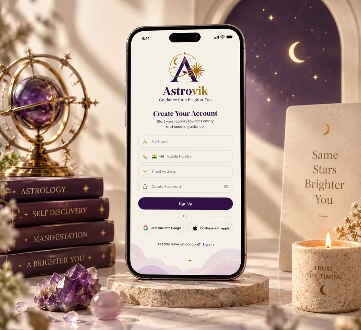 Astrovik sign-up screen on a phone, surrounded by crystals and astrology books